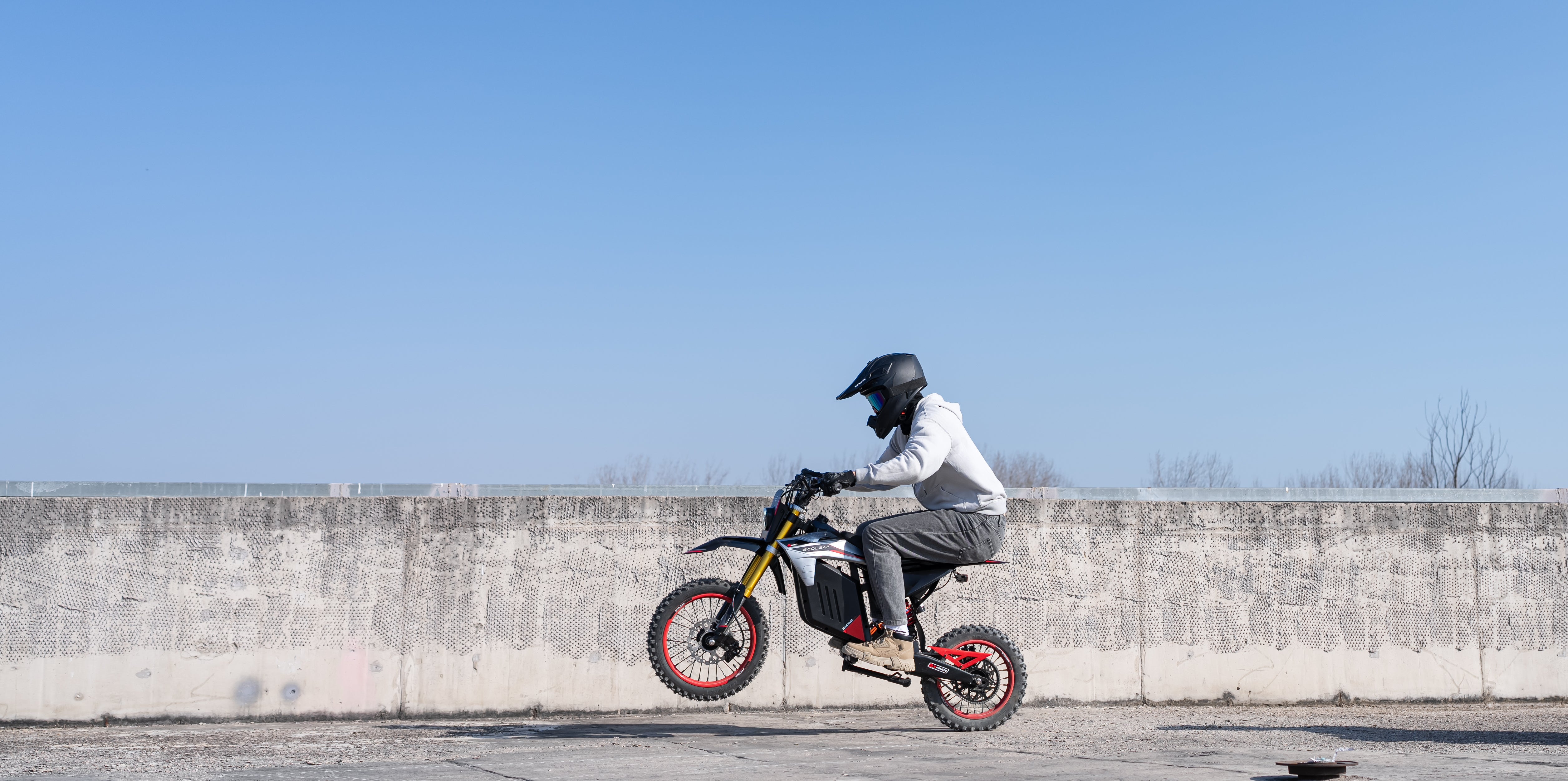 Evoltrix Conqueror X Electric Dirt Bike Performing Wheelie Stunt, High-Performance Off-Road Motocross Bike