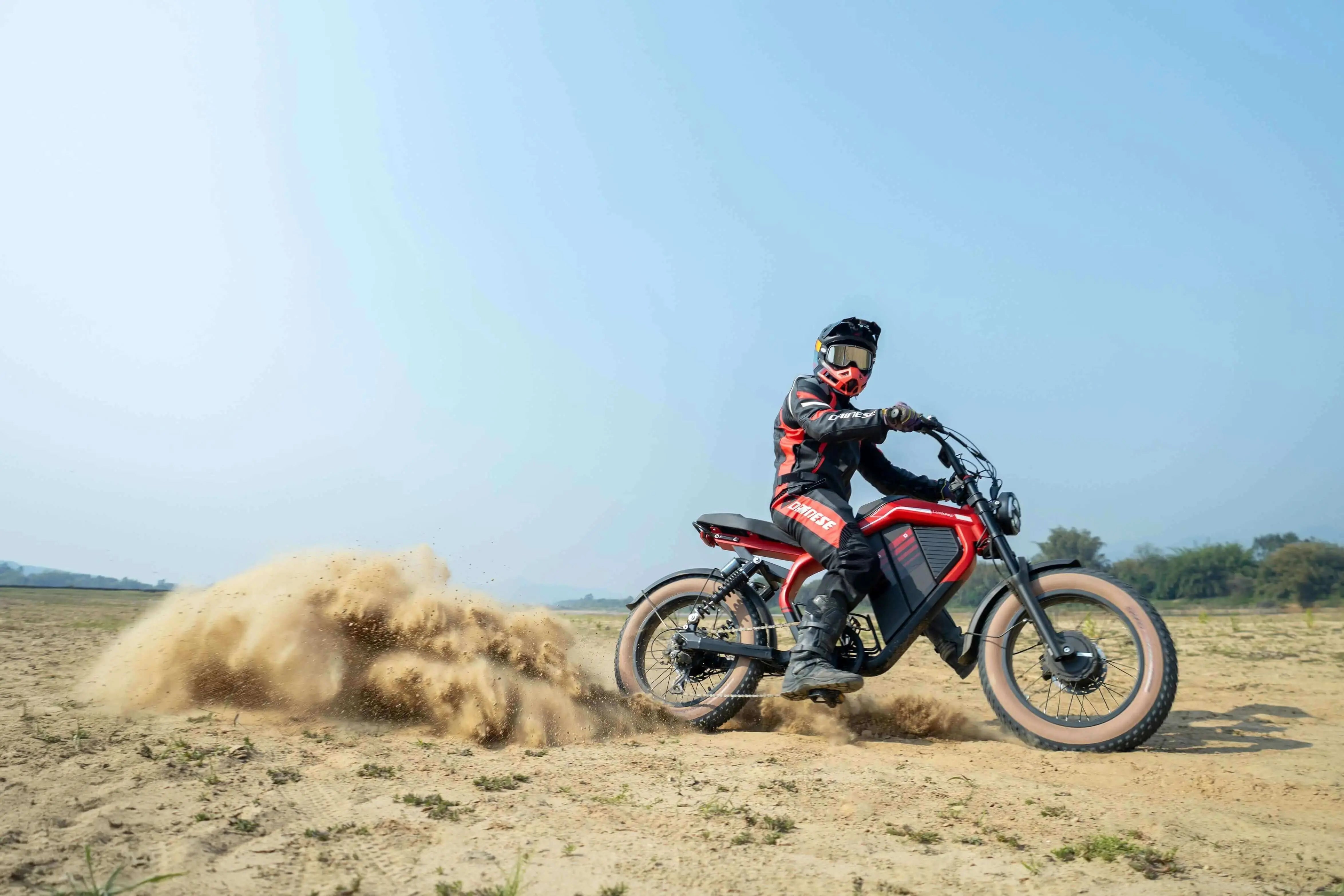 Rider on a red Evoltrix electric off-road motorcycle in our beginner’s off-road electric biking guide
